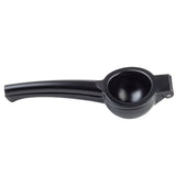 A black TableCraft handheld lemon or citrus juicer made of coated aluminum alloy, shown closed with two long handles and a round fruit compartment, viewed on a white background.