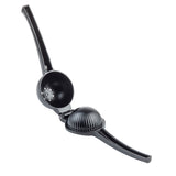 A black TableCraft juicer made from coated aluminum alloy features two long handles and a hinged, rounded pressing chamber. The top half has juice holes, while the ribbed lower half crushes fruit, all set against a white background.