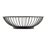 A round, black powder coated steel fruit bowl from the Parisian Collection Wire Basket, featuring an open, airy design with outward-curving wires and a solid circular base. Contents remain visible against the plain white background.