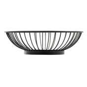 A round, black powder coated steel fruit bowl from the Parisian Collection Wire Basket, featuring an open, airy design with outward-curving wires and a solid circular base. Contents remain visible against the plain white background.