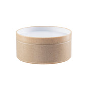 A round, beige, textured container with a removable lid, resembling natural cork. Crafted from styrene plastic, its inside is smooth and white, providing a clean contrast to the earthy exterior. The background is plain white.