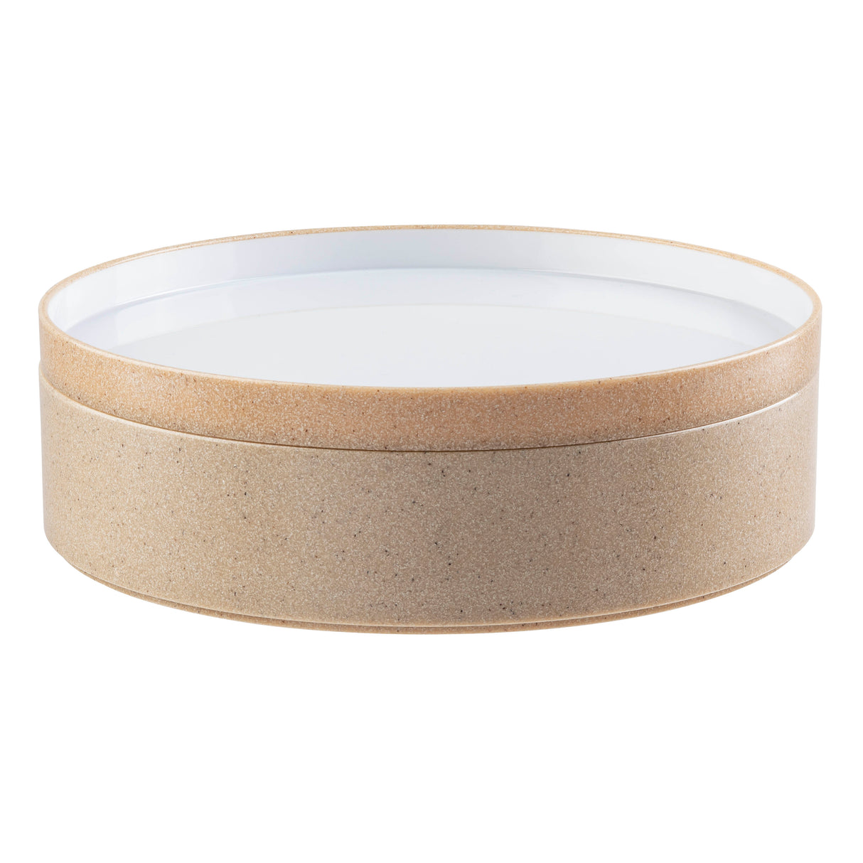 A round, lidded container with a natural beige cork exterior and a smooth, white, flat top surface. The simple, modern design features clean lines and neutral colors. Both stackable and practical, the lid fits seamlessly onto the cylindrical base.