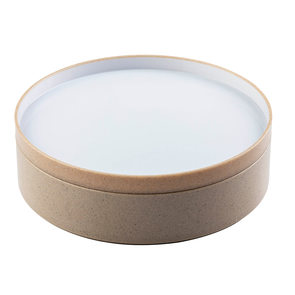 A round, shallow bowl with beige sides and a white, flat top. Made of natural, textured material—possibly ceramic or eco-friendly composite—it features a minimalist, modern design and is stackable for easy storage.