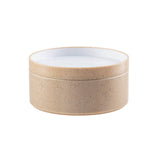 A round, beige bowl with a smooth, textured exterior and a white, glossy interior. This stackable container has no visible handles or decorations and is photographed against a plain white background.