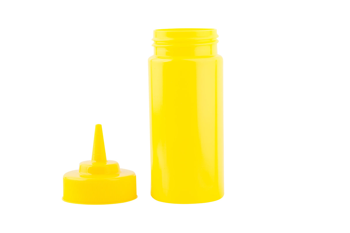 A bright yellow mustard bottle stands upright with its pointed nozzle cap detached and resting beside it on a white background. This WideMouth Squeeze Bottle is empty, clean, dishwasher safe, and commonly used for condiments like mustard.