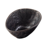 A dark, irregularly shaped ceramic bowl with a textured, stone pattern surface and an uneven rim. The bowl has a somewhat organic, handmade appearance and is photographed on a white background.