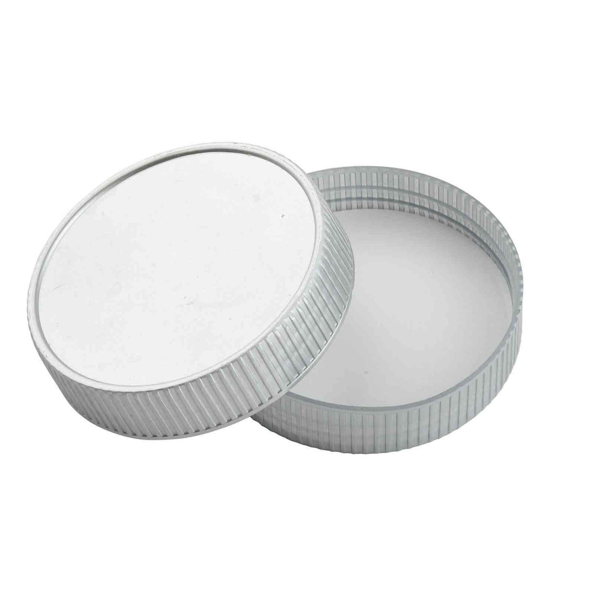 A round, silver-colored metal container with a ridged edge is shown with its lid partially removed at an angle beside the base. The plain white interior suggests it may fit a TableCraft item or serve as a replacement lid. The container appears empty.