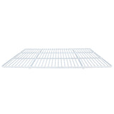 A white metal wire shelf, possibly an Empura Parts Left Shelf, is shown from a low angle. The rectangular grid of horizontal and vertical wires forms a flat, open surface often used in Empura Refrigeration units. The background is plain white.