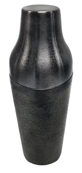 A premium matte black stainless steel cocktail shaker with a textured surface stands upright, cap securely on top. Its modern, sleek design and cylindrical shape are highlighted by lighting against a plain white background.