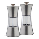 This TableCraft Salt & Pepper Mill Set features modern grinders with stainless steel tops and bottoms, plus transparent middles that showcase the contents. Positioned side by side, they add a sleek touch to any table setting.