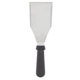 A TableCraft metal putty knife with a wide, flat, rectangular stainless steel turner blade and black plastic handle is photographed vertically against a white background, blade at the top and handle at the bottom.