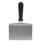 A stainless steel turner with a wide rectangular blade and a black plastic handle, shown upright against a white background. The blade has a straight edge, and the handle is centered above the blade for grip.