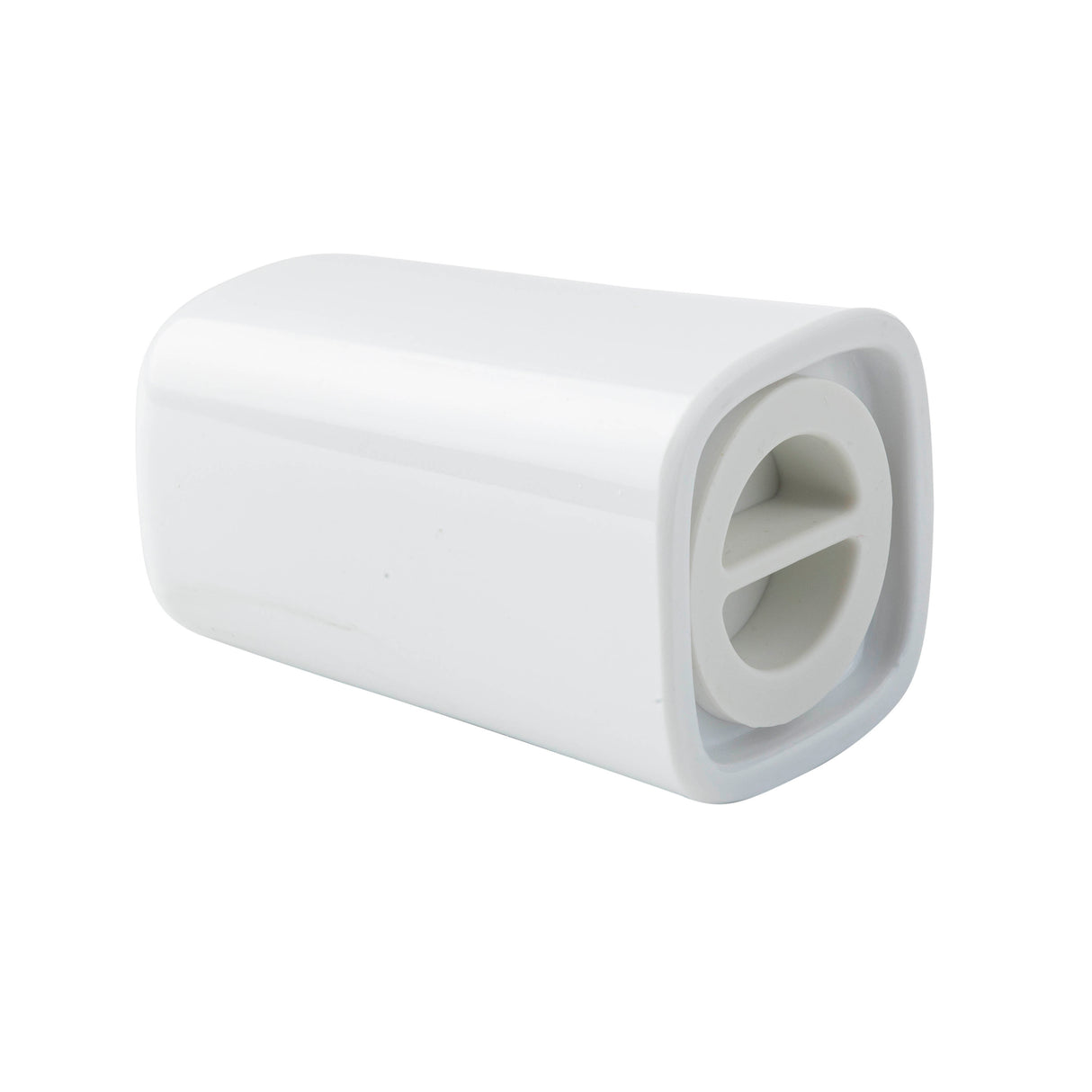 A white, rectangular melamine object lies on its side, with a rounded edge and an open end featuring two circular holes separated by a divider. The glossy surface and minimalist design resemble a TableCraft Salt & Pepper Shaker Set.