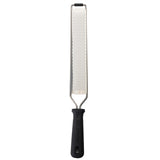 The PerfectGrip Grater by TableCraft is a stainless steel grater with a long, narrow surface and fine, sharp holes. Its black, textured handle ensures a secure grip and the simple design makes it ideal for zesting or grating foods.
