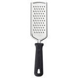 The PerfectGrip Grater is a stainless steel grater with medium-sized holes and a black ergonomic handle featuring a hanging hole. Its rectangular, slightly curved surface is ideal for shredding cheese or vegetables against a white background.