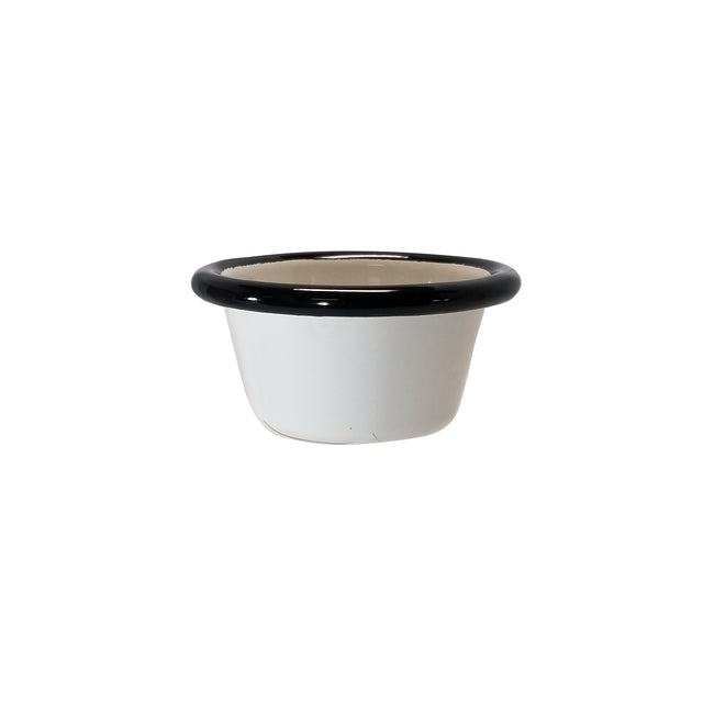 A small, white Enamelware ramekin with a rounded shape and black rim, placed against a plain white background. This 2 oz. porcelain enamel bowl has a smooth, glossy finish and appears empty.