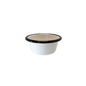 A small, round, 4 oz enamelware ramekin with slightly flared sides and a thick black rim sits on a plain white background. Its cream-colored interior and porcelain enamel finish give it a classic, minimalist look.