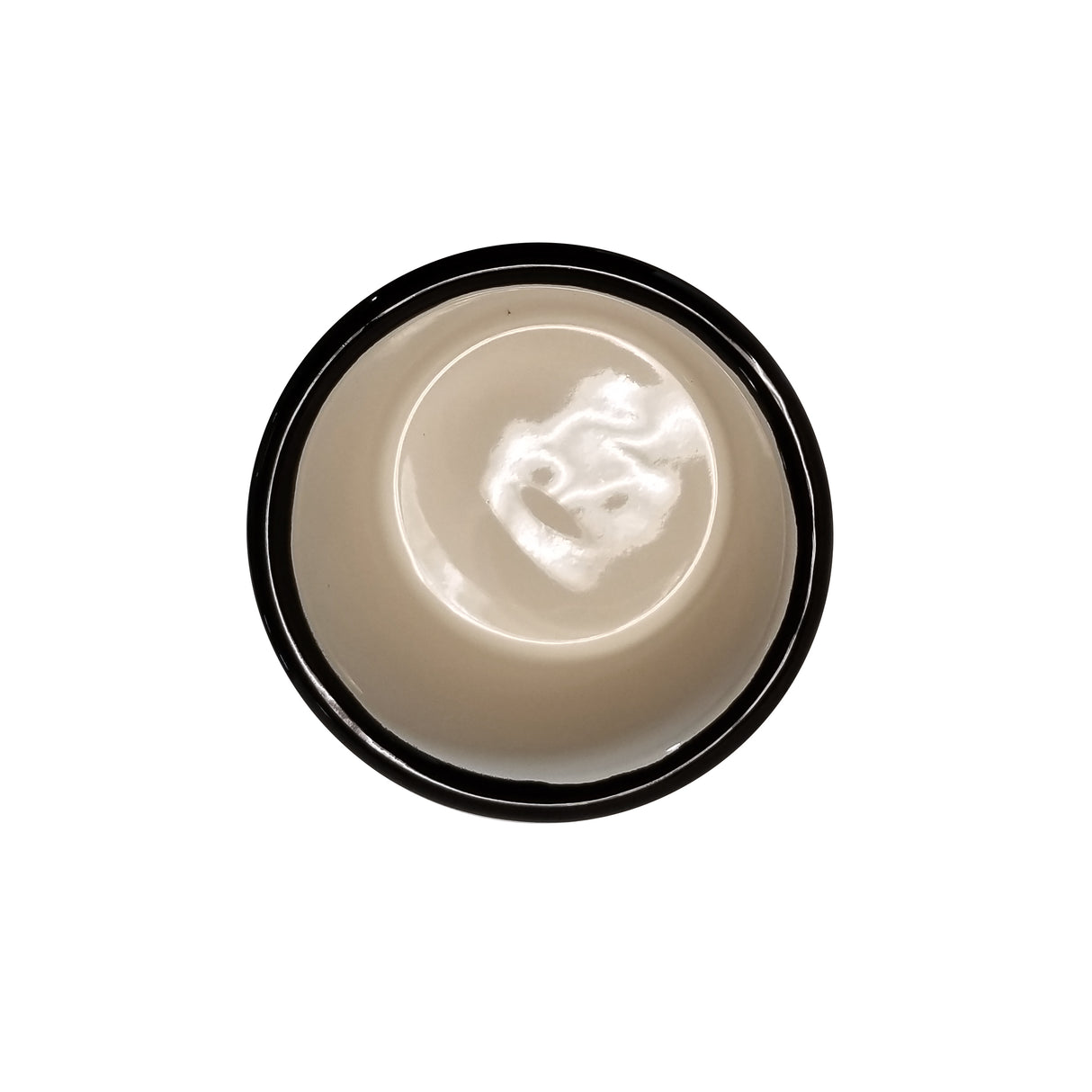 A round, beige Enamelware ramekin with a dark rim is photographed from above against a plain white background. The 5 oz bowl appears empty, and glossy reflections are visible inside.