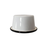 A 5 oz Enamelware ramekin is pictured upside down on a plain white background. The porcelain enamel bowl features a smooth, glossy surface and a black rim, with lighting creating small reflections on its finish.