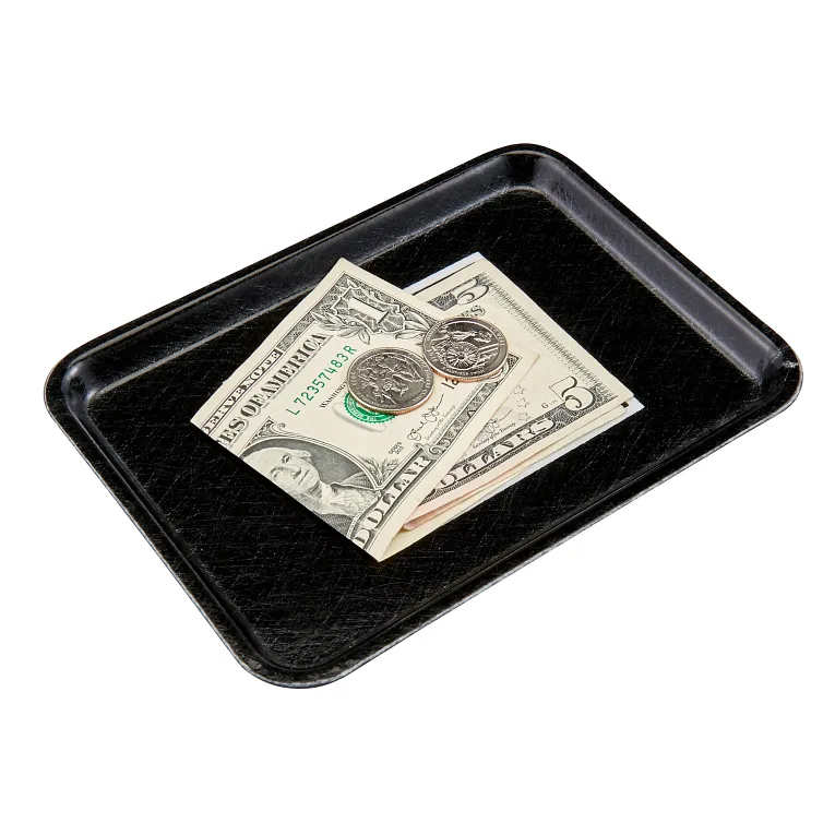 A small black Camtray holds a five-dollar bill, a one-dollar bill, and two quarters. The high-impact fiberglass tray is placed on a white surface, with the bills and coins neatly arranged in the center.