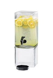 A clear, rectangular BPA free glass beverage dispenser filled with lemonade, ice, and lemon slices. It features a black spigot near the middle and sits on a matching glass base. The lid rests below the dispenser against a white background.