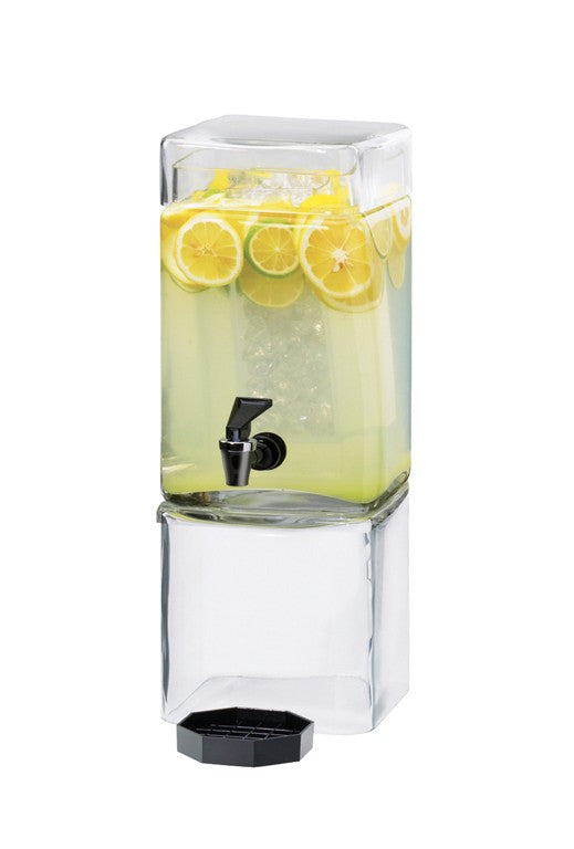 A clear, rectangular BPA free glass beverage dispenser filled with lemonade, ice, and lemon slices. It features a black spigot near the middle and sits on a matching glass base. The lid rests below the dispenser against a white background.