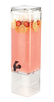 A clear, rectangular 3 gallon beverage dispenser filled with pink lemonade, ice, lemon slices, and strawberry slices. The BPA free container has a black spigot near the bottom and sits on a transparent stand with the lid closed.