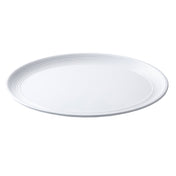 A plain, round, white Pulito Collection Platter by TableCraft Products with a slightly raised rim featuring concentric circular grooves. The empty melamine platter is photographed on a white background, emphasizing its simple and clean design.