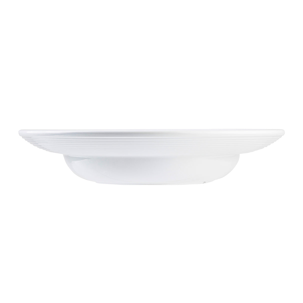 A plain white, round TableCraft plate with subtle horizontal ridges along the rim, viewed from the side against a white background. The plate has a slightly raised edge and a small, circular base, giving it a shallow, elegant appearance.