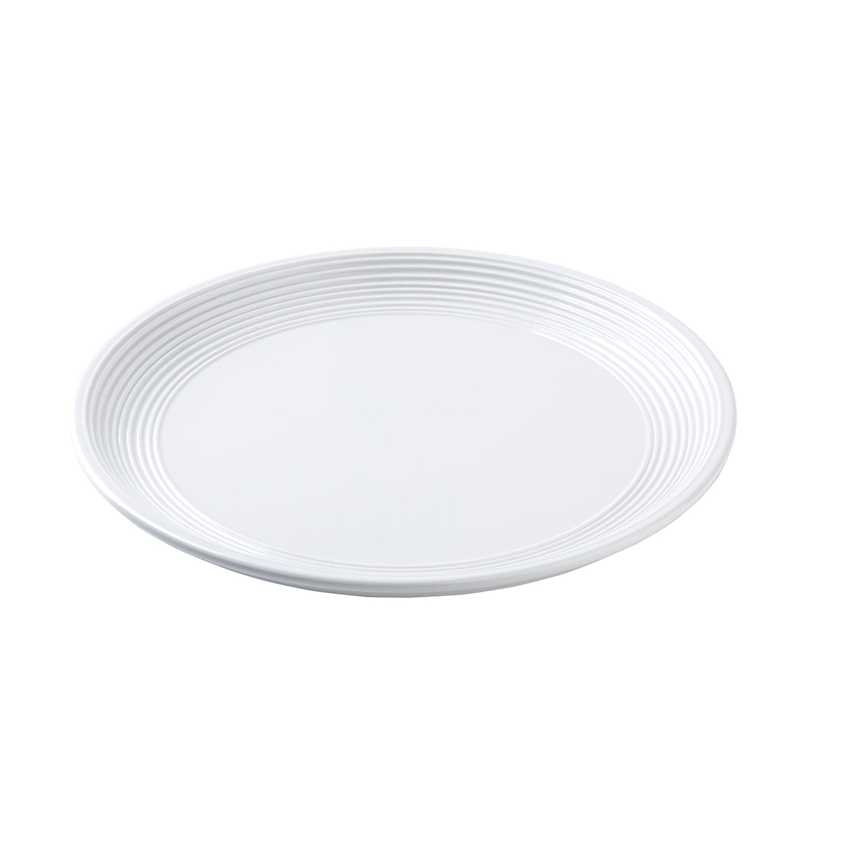 A plain white round plate with a smooth surface and subtle concentric ridges along the outer rim, photographed against a white background. The Pulito Collection Plate is empty and seen from a slight angle.
