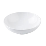A plain, white, round Pulito Collection bowl with a smooth interior and subtle horizontal ridges near the base, photographed against a white background. This 24 oz. bowl features a wide rim and gently sloping sides, perfect for any meal.
