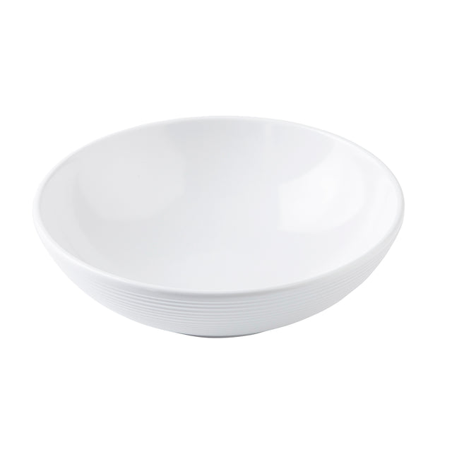A plain, white, round Pulito Collection bowl with a smooth interior and subtle horizontal ridges near the base, photographed against a white background. This 24 oz. bowl features a wide rim and gently sloping sides, perfect for any meal.