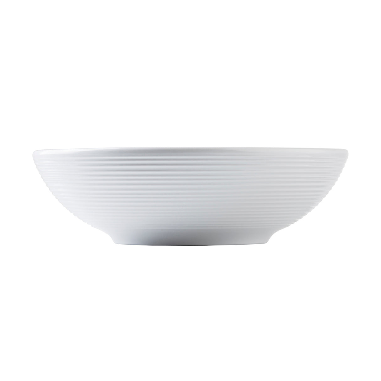 A white ceramic Pulito Collection bowl with a wide, shallow shape and horizontal ridges encircling the exterior. The bowl has a slightly raised, narrow base and a smooth, minimalist design. The background is plain white.