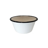 A small, round porcelain enamel bowl with a beige interior and black rim, shown against a plain white background. The bowl features smooth sides and a simple, classic design.