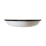 A shallow, round white porcelain enamel plate by TableCraft Products with a black rim, viewed from the side against a white background. The enamelware plate has a smooth finish and minimalist design, ideal for serving or baking.