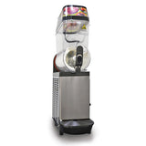 A front-facing Single Bowl Frushee Beverage Machine with a 3.7 gallon capacity, stainless steel base, large clear cylindrical tank, black dispensing handle, slush density controls, and fruit images on the top cover. Drip tray included at the bottom.