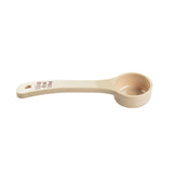 A beige polycarbonate measuring spoon with a flat handle, labeled 45 mL 3 Tbsp in red text. The round bowl and NSF certification make this Spoonout reliable for any kitchen. Handle features a hole for hanging. Background is plain white.