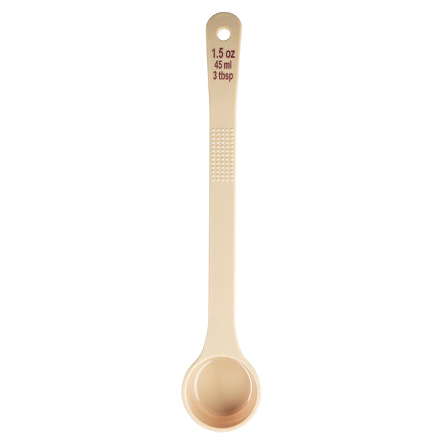 A beige polycarbonate measuring spoon with a long handle is shown on a white background. The handle has a textured grip and is labeled with measurements: “1.5 oz, 45 ml, 3 tbsp” in brown text. The Spoonout bowl is rounded at the end.