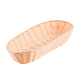 A light brown, oval-shaped hand-woven basket with a smooth rim and open top sits empty on a plain white background. The tightly interlaced wicker pattern of this TableCraft 1118W gives it a sturdy, elegant appearance.