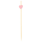 A wooden cocktail pick, crafted from bamboo pinewood, with a pointed end and a small flat pink heart near the top, set against a plain white background—perfect as decorative picks for any gathering.