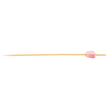 A TableCraft 11205 bamboo pinewood pick with a pointed tip features a small, pink, heart-shaped decoration near one end. The background is plain white, highlighting this charming example of decorative picks.
