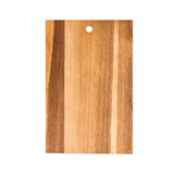 A rectangular Acacia Serving Board with a hole near the top edge, displaying natural wood grain patterns in light and medium brown shades. This Wood Serving Board by TableCraft is photographed against a white background.