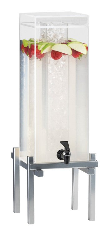 A tall, clear 3 gallon beverage dispenser on a metal stand, filled with water, strawberries, and green apple slices floating at the top. It features a central ice chamber and a black spigot at the front for pouring drinks.