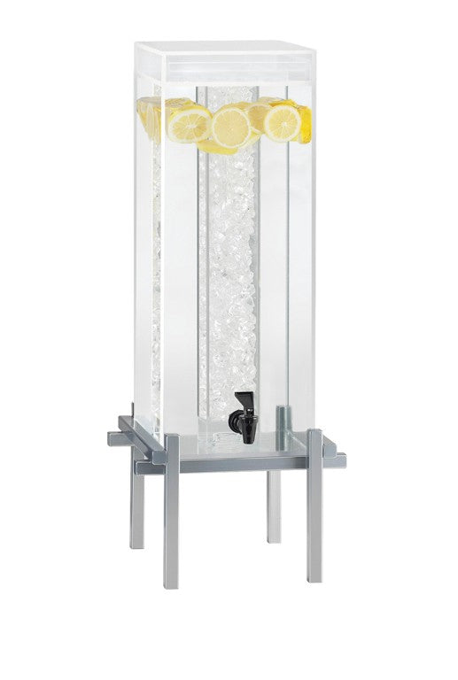 A tall, rectangular 5-gallon beverage dispenser filled with ice in its spacious ice chamber and garnished with lemon slices, stands elegantly on a modern silver metal base with a black spigot for easy drink dispensing.