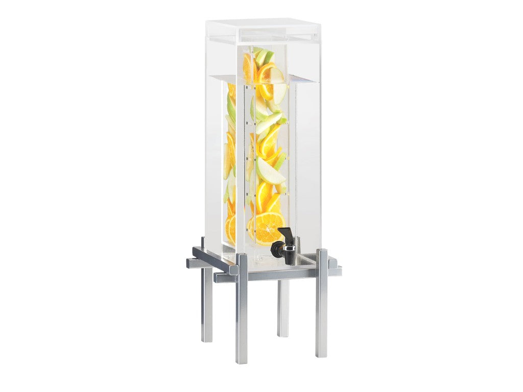 A tall, clear 5 gallon beverage dispenser filled with water and slices of lemon, orange, and green apple. It stands on a sleek, modern metal frame with a small black spigot and an infusion chamber for fresh flavor in every pour.