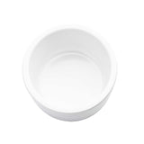A plain, empty, round white 4 oz ramekin is shown from above on a white background. The bowl has smooth edges and a glossy finish, with no patterns or decorations. The image is minimalistic and well-lit.