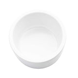 A plain, round, white 6 oz ramekin bowl is shown from above on a white background. The bowl is empty and casts a faint shadow inside, highlighting its smooth and glossy surface.