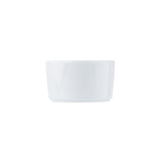 A plain, white, 6 oz ceramic ramekin is centered on a white background. It has smooth sides, a glossy finish, and a simple, round shape with a slightly flared rim. The minimalist composition highlights the ramekin’s clean design.