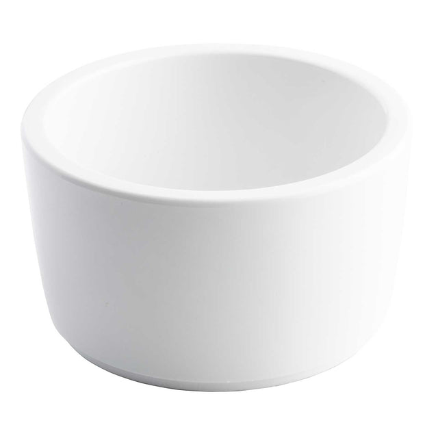 A plain, white, round ceramic bowl with smooth sides and a slightly thick rim. This 14 oz. bowl has a matte finish and is photographed against a white background, giving it a clean, minimalist appearance reminiscent of a classic ramekin.