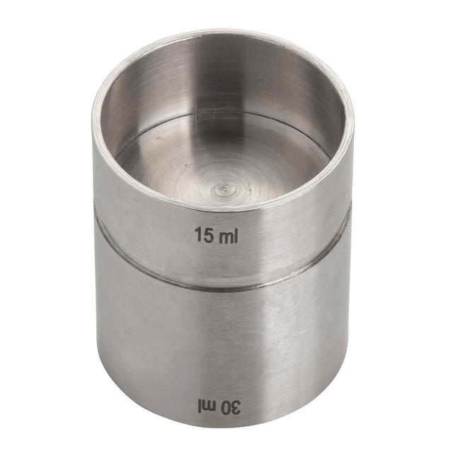 A stainless steel jigger with two cylindrical sections for measuring liquids. The upper section is labeled 15 ml and the lower section 30 ml, making this thimble jigger ideal for precise pours. It features a smooth, metallic finish and no handle.